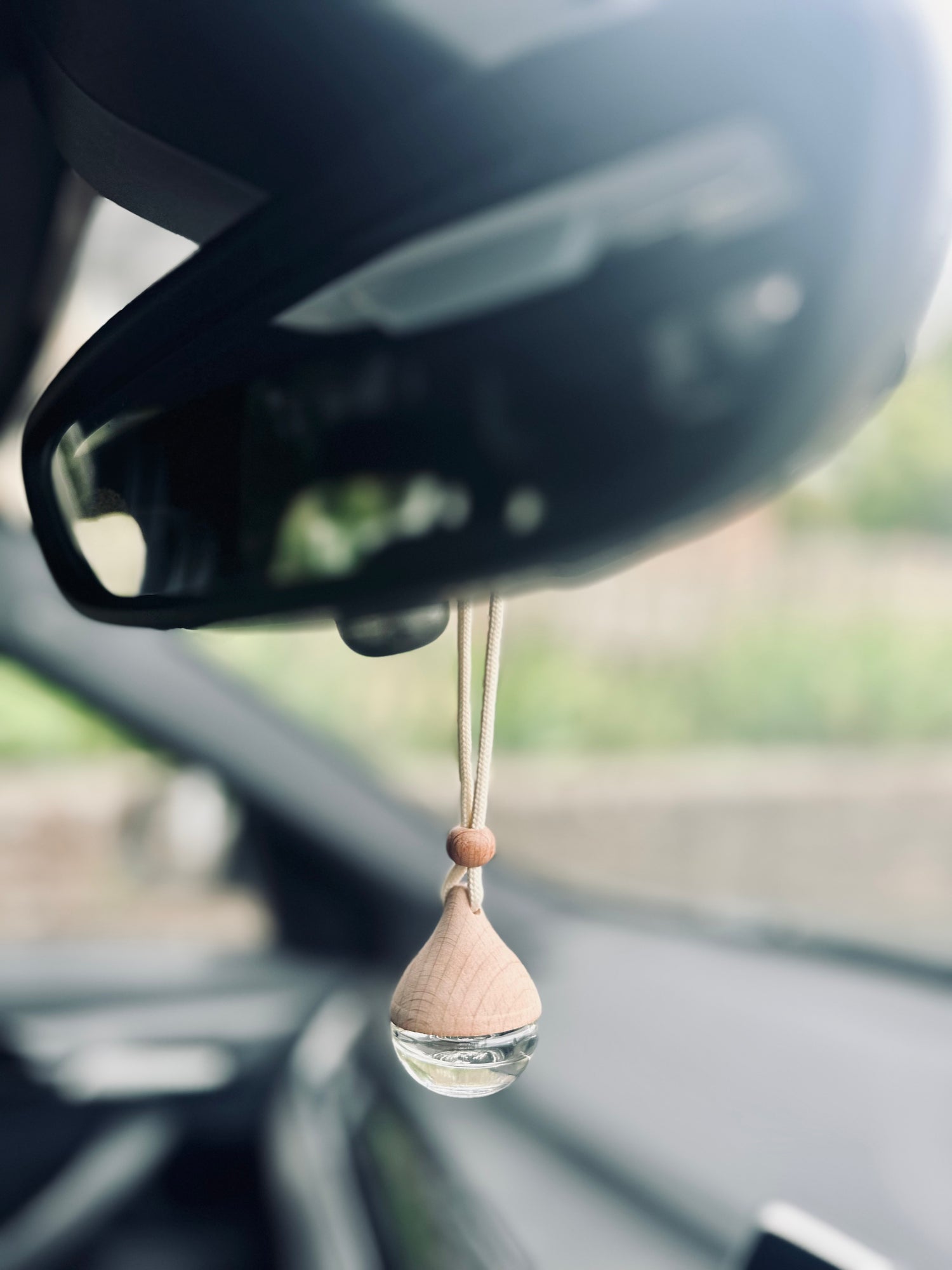 elena london luxury car diffuser hanging from rear view mirror